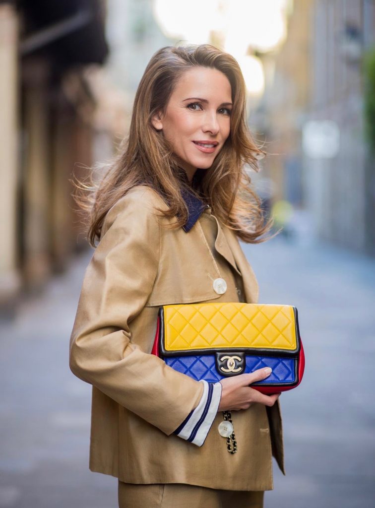 BARCELONA, SPAIN - NOVEMBER 27: Alexandra Lapp wearing Safari look, wide cut khaki pants from Steffen Schraut, khaki jacket with blue collar and blue and white strips on the bottom of the sleeve from Steffen Schraut, denim shirt by Steffen Schraut, So Kate Pumps from Christian Louboutin in denim, Chanel 2.55 bag in red, blue and yellow with golden logo buckle on November 27, 2017 in Barcelona, Spain.