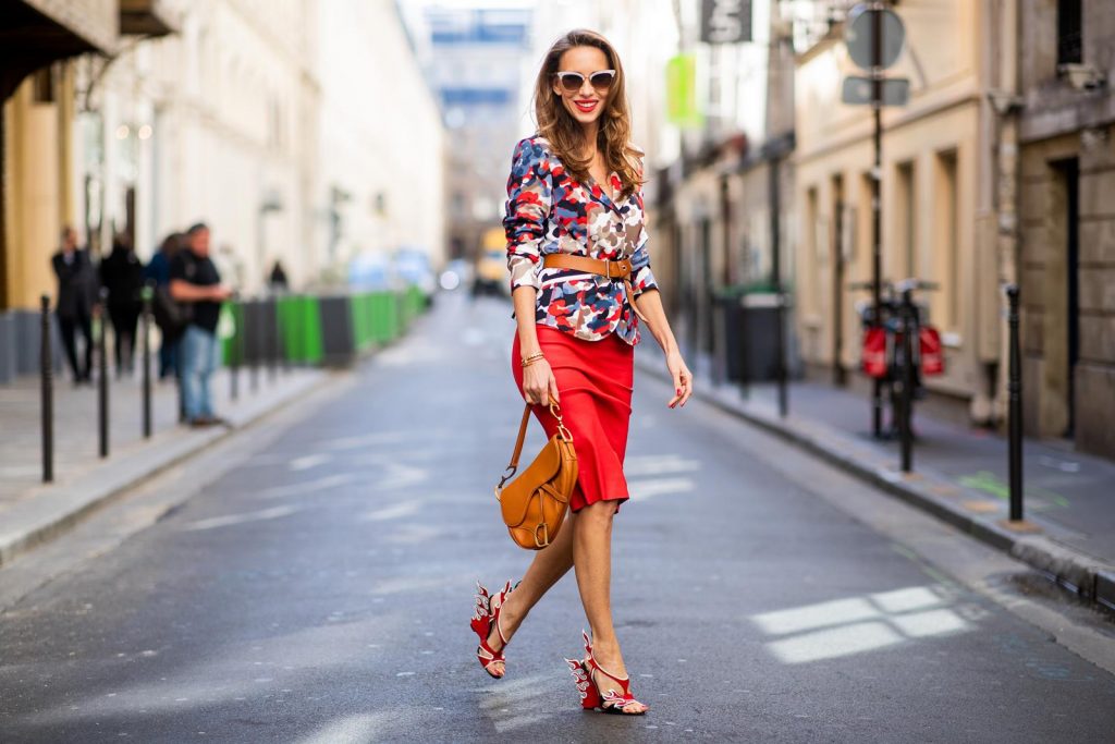 Alexandra Lapp in a Prada Flame Sandals / Graphic Pattern Look wearing a Cindy Blazer with graphic pattern by Airfield, a red leather pencil skirt by American Retro, red flame wedge sandal heels from Prada and a vintage Dior saddle bag in cognac, Gucci cat-eye radiant ivory sunglasses and brown cognac soft leather belt by Prada is seen during Paris Fashion Week Womenswear Spring/Summer 2019 on September 25, 2018 in Paris, France.