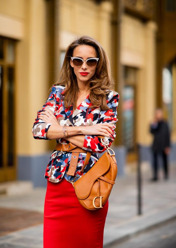 Alexandra Lapp in a Prada Flame Sandals / Graphic Pattern Look wearing a Cindy Blazer with graphic pattern by Airfield, a red leather pencil skirt by American Retro, red flame wedge sandal heels from Prada and a vintage Dior saddle bag in cognac, Gucci cat-eye radiant ivory sunglasses and brown cognac soft leather belt by Prada is seen during Paris Fashion Week Womenswear Spring/Summer 2019 on September 25, 2018 in Paris, France.