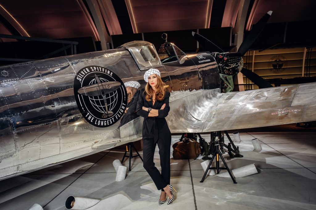 Alexandra Lapp in a Silver Spitfire Look, wearing a IWC Spitfire watch while visiting the IWC Schaffhausen booth at the SIHH 2019 in Geneva.