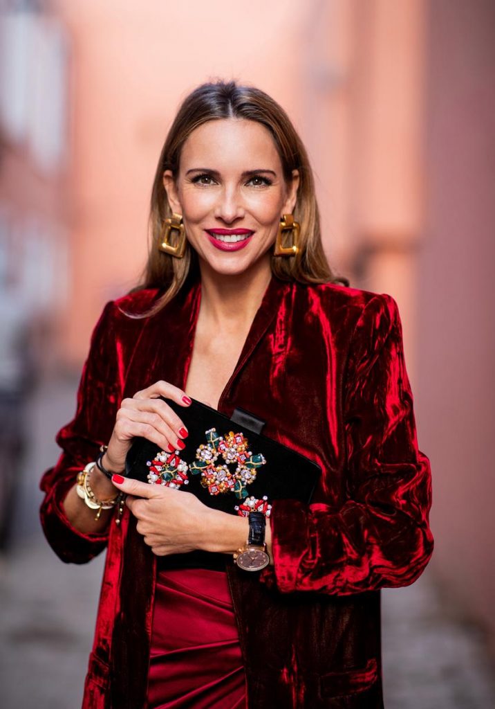Alexandra Lapp in a wrap skirt look wearing a loose fit crushed velvet red blazer from Alice + Olivia, a black top from Jadicted, a satin red mini skirt with a rap-effect from Caroline Constas, a black velvet handbag with sparkling stones and pearls from Roger Vivier, black woven Sienna sandals from Cult Gaia, gold earrings from Zara on November 26, 2018 in Marrakech, Morocco. (Photo by Christian Vierig/Getty Images)