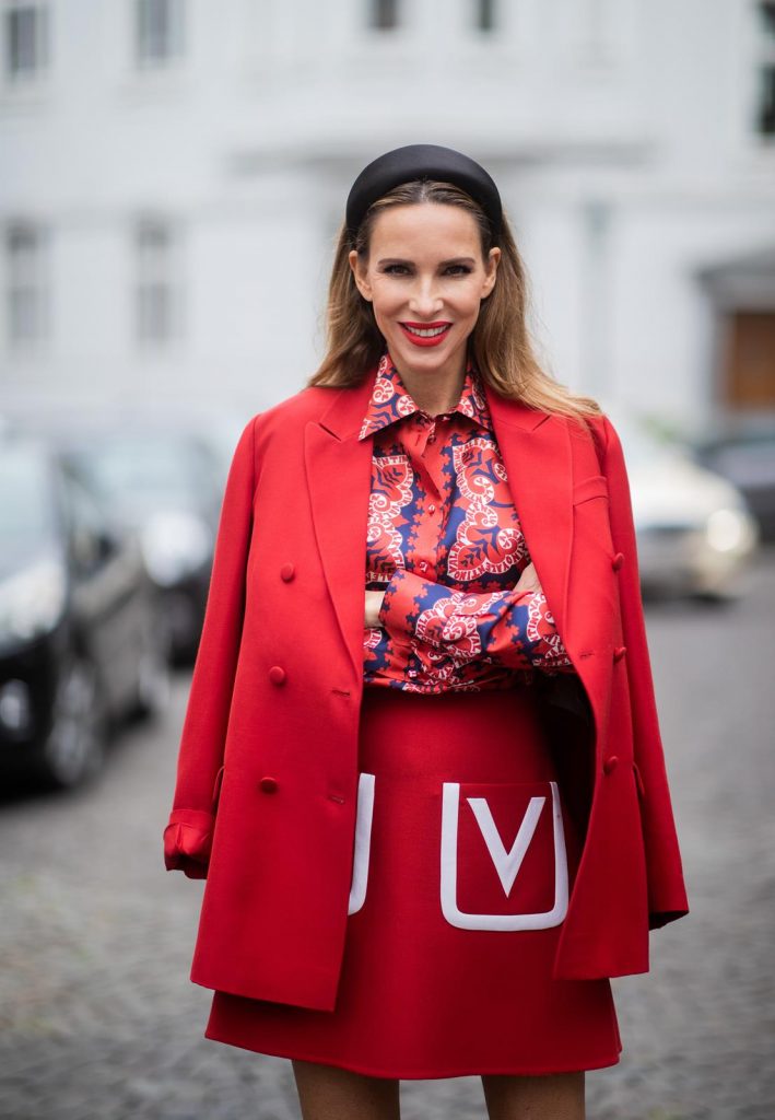 Alexandra Lapp in a Valentino Look, wearing a short red wool skirt with the embroidered V Logo, with a matching long oversized blazer, a logo printed twill shirt in blue white and red- all from Valentino, a black silk satin headband from Prada on May 01, 2019 in Duesseldorf, Germany. (Photo by Christian Vierig/Getty Images)