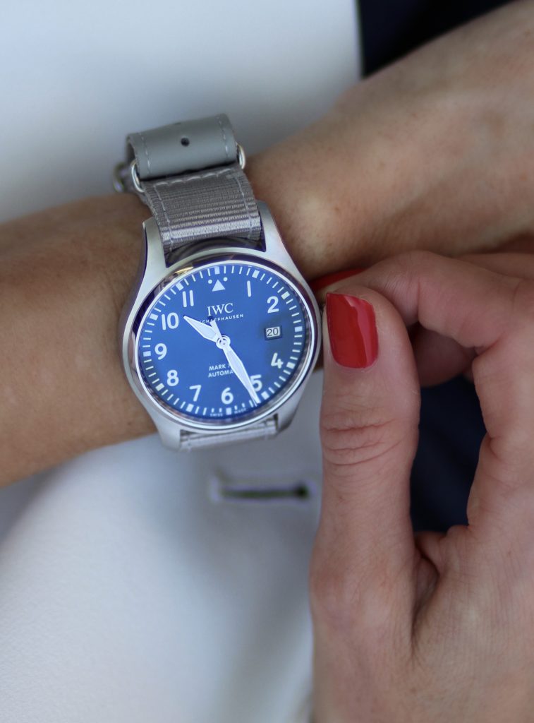 Alexandra Lapp in a Summer Vibes look, wearing a IWC-Schaffhausen Mark XIII Pilot's watch and summer strap