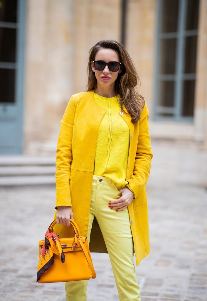 PARIS, FRANCE - FEBRUARY 26: Alexandra Lapp is seen wearing a yellow trend, leather coat in yellow from Milestone by Peter Hahn, yellow Looxent pullover from Peter Hahn, MYBC Jeans from Peter Hahn, slingback-pumps in orange from The Attico, 28 Hermes Kelly bag in orange, silk scarf from Hermes during Paris Fashion Week - Womenswear Fall/Winter 2020/2021 : Day Three on February 26, 2020 in Paris, France.