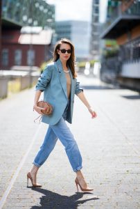 DUSSELDORF, GERMANY - JUNE 09: Alexandra Lapp is seen wearing a casual chic look, Victoria Beckham tanktop in beige, GRLFRND high waist Jeans Devon, double breasted blazer in blue from Low Classic, the Pouch mini clutch from Bottega Veneta and Dylan cat-eye sunglasses in black with silver all from NET-A-PORTER is seen on June 09, 2020 in Dusseldorf, Germany.