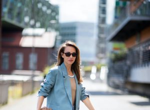 DUSSELDORF, GERMANY - JUNE 09: Alexandra Lapp is seen wearing a casual chic look, Victoria Beckham tanktop in beige, GRLFRND high waist Jeans Devon, double breasted blazer in blue from Low Classic, the Pouch mini clutch from Bottega Veneta and Dylan cat-eye sunglasses in black with silver all from NET-A-PORTER is seen on June 09, 2020 in Dusseldorf, Germany.