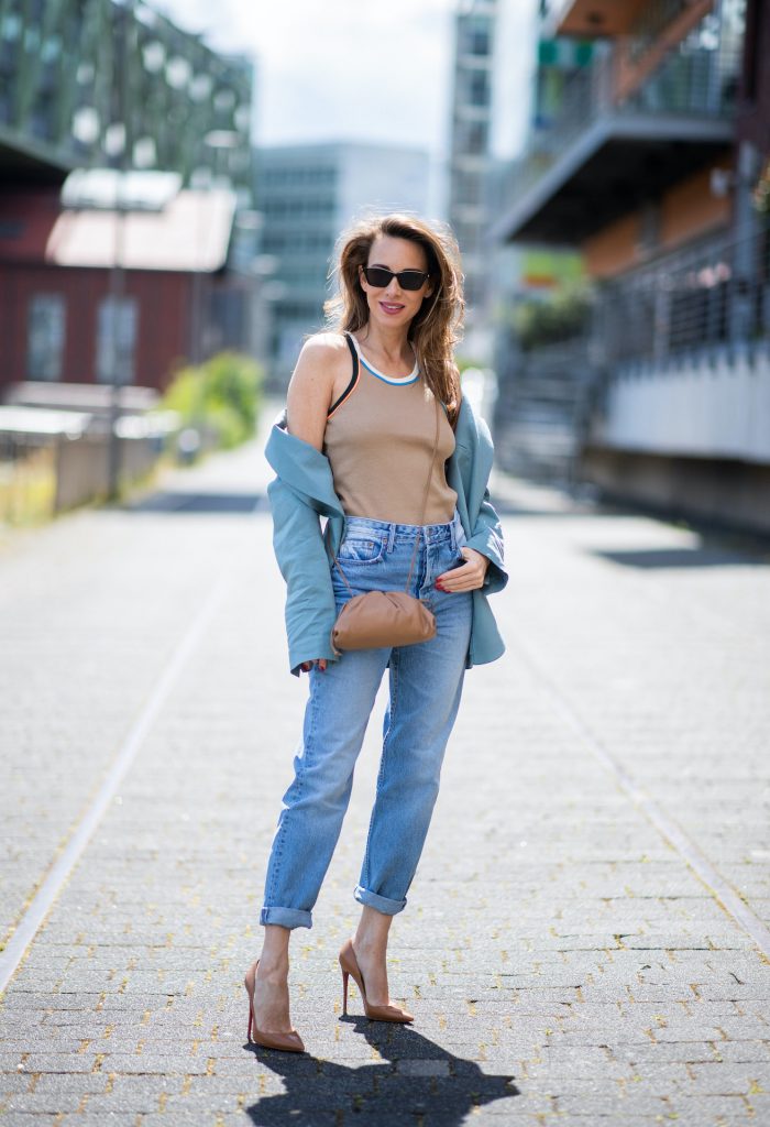 DUSSELDORF, GERMANY - JUNE 09: Alexandra Lapp is seen wearing a casual chic look, Victoria Beckham tanktop in beige, GRLFRND high waist Jeans Devon, double breasted blazer in blue from Low Classic, the Pouch mini clutch from Bottega Veneta and Dylan cat-eye sunglasses in black with silver all from NET-A-PORTER is seen on June 09, 2020 in Dusseldorf, Germany. 
