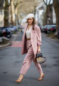 Alexandra Lapp is seen wearing pastel suits from FRANKIE SHOP Pernille single-breasted blazer and Pernille high-rise pants in pastel pink , vintage beret in off white, GUCCI logo belt in camel, GUCCI monogram backpack in black and brown, GUCCI hair clips and CHRISTIAN LOUBOUTIN Kate pumps in camel.