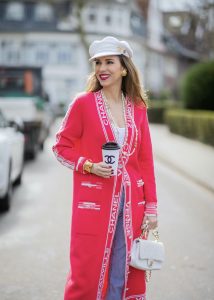 Alexandra Lapp is seen wearing CHANEL cardigan, CHANEL vintage jewelry and brooch, CHANEL BAKER BOY hat, JAMES PERSE tank top, LEVIS denim, CHANEL padded bag, PRADA pumps. Complete look by SuperBrands Secondhand.