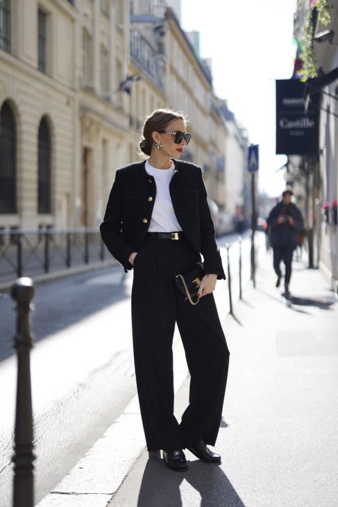 Alexandra Lapp is seen wearing ROSSI pants in black, CELINE bag, CELINE belt in black,CELINE trainer low lace-up loafer, MASSIMO DUTTI t-shirt, CELINE chasseur jacket in boucle matte black, TIFFANY City HardWear in gold during a street style shoot.